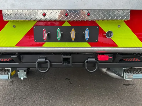 Rear bumper center section with hitch point and fittings.